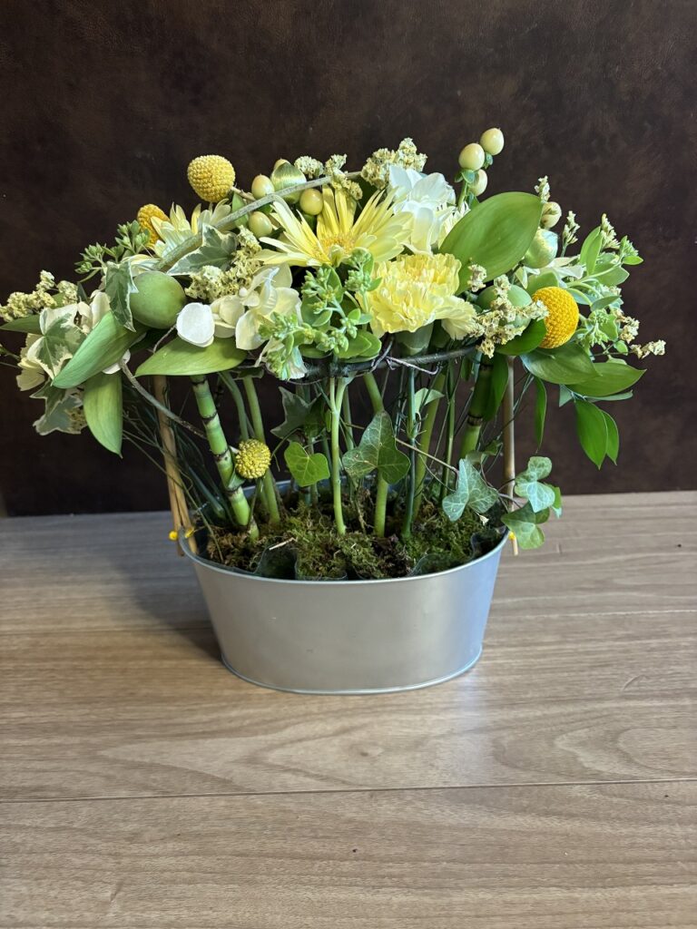 Materials: Gerbera, carnation, plum, sedum, ruscus, hypericum, grass, statice, wheat, ivy, moss